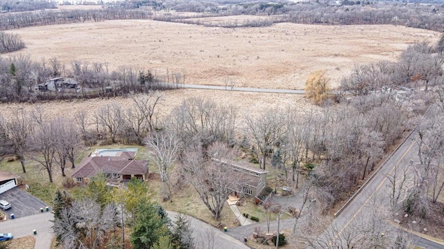 birds eye view of property with a rural view