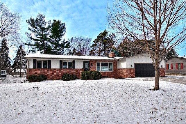 ranch-style home with a garage