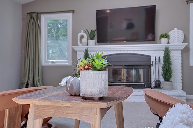 interior space with carpet flooring and a fireplace