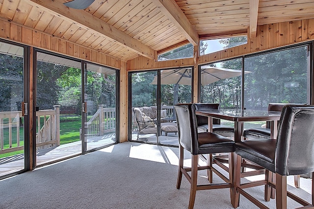 unfurnished sunroom with vaulted ceiling with beams and wooden ceiling