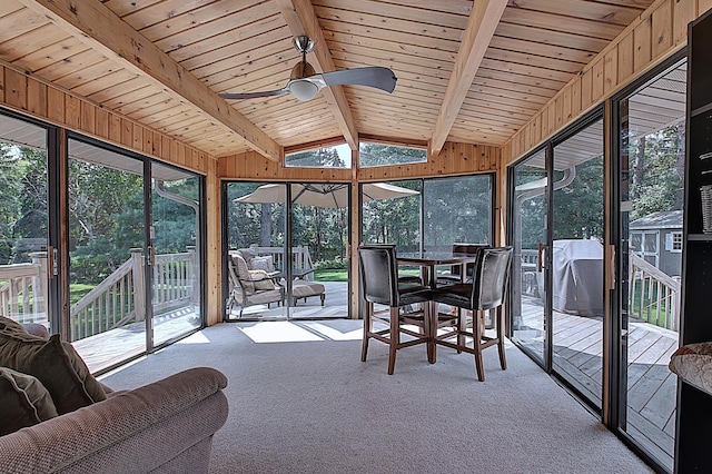 sunroom featuring wood ceiling, ceiling fan, and lofted ceiling with beams