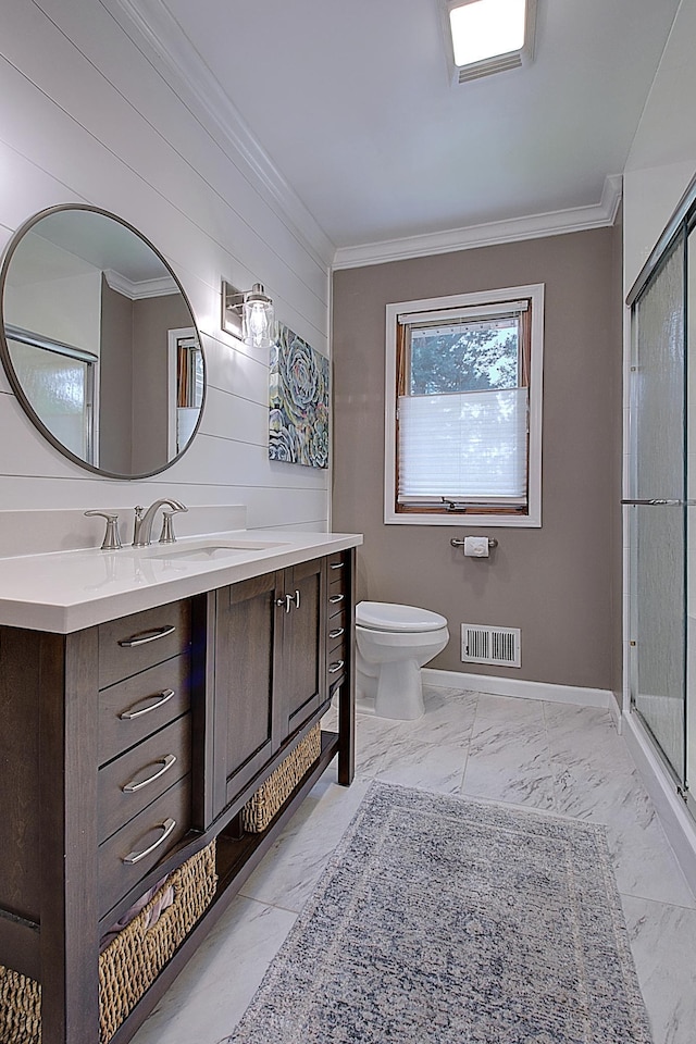 bathroom with ornamental molding, walk in shower, vanity, and toilet