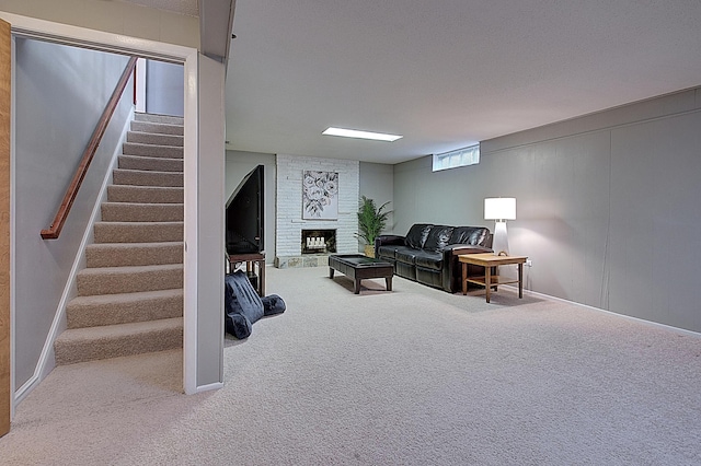 living room with a fireplace, a textured ceiling, and carpet