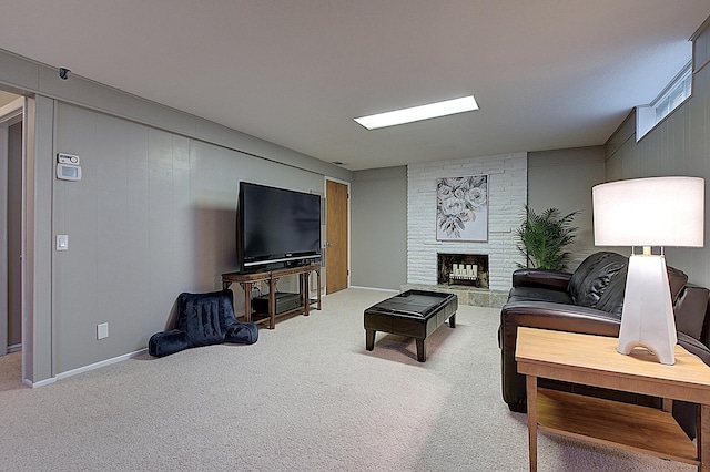 living room with a fireplace and carpet