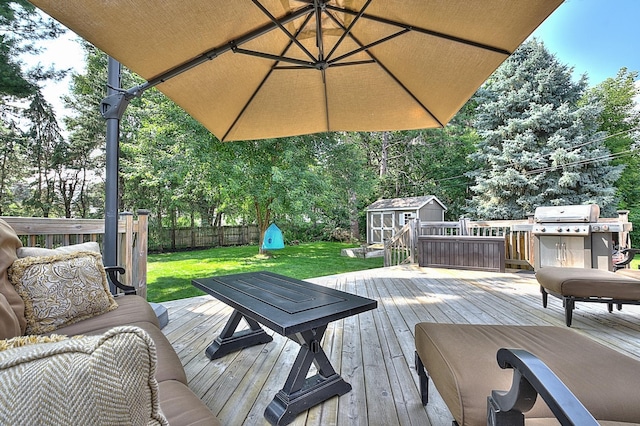 wooden deck with a grill, a yard, and a shed