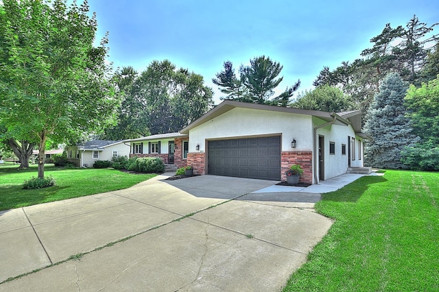 ranch-style home featuring a garage and a front lawn