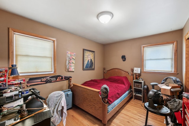 bedroom with light hardwood / wood-style flooring