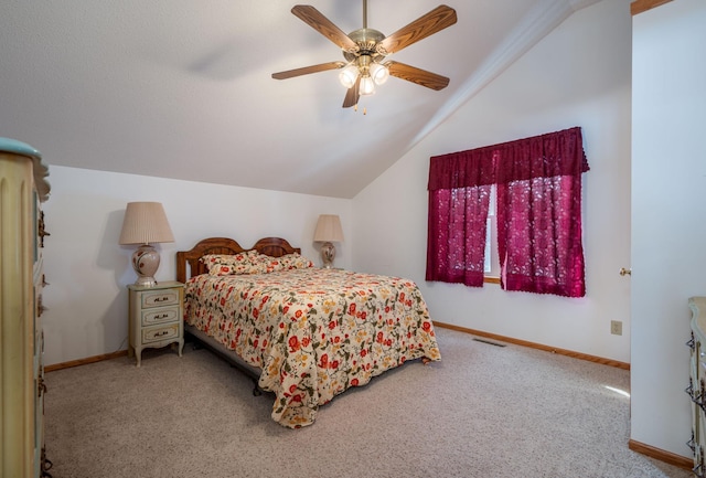 bedroom featuring ceiling fan, light colored carpet, and vaulted ceiling