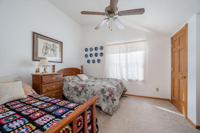 bedroom featuring ceiling fan, light colored carpet, vaulted ceiling, and a textured ceiling