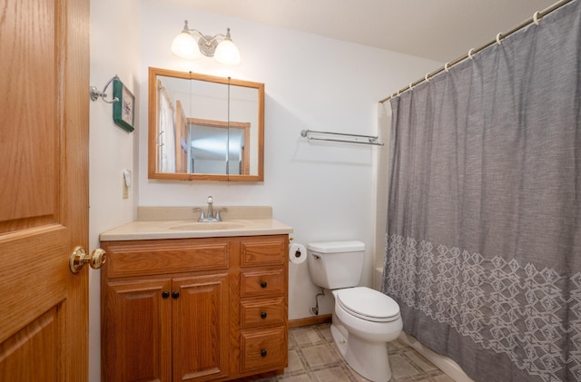 bathroom with vanity, toilet, and a shower with shower curtain