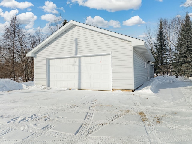 view of snow covered garage