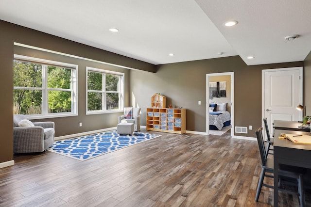 game room with recessed lighting, wood finished floors, visible vents, and baseboards