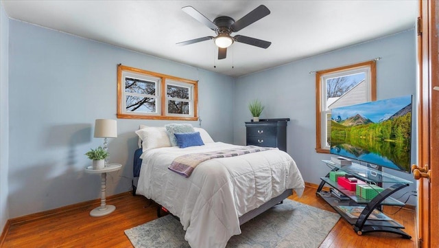 bedroom featuring hardwood / wood-style flooring and ceiling fan