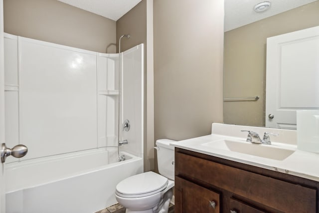 full bathroom featuring shower / washtub combination, toilet, vanity, and a textured ceiling