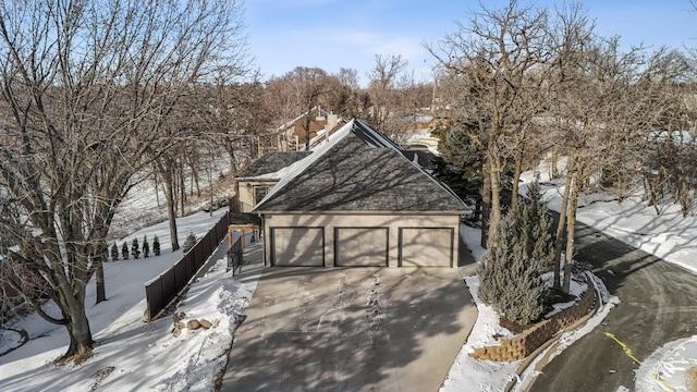 view of front of home with a garage and concrete driveway