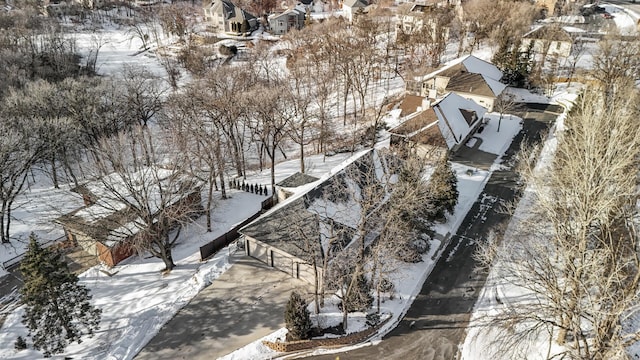 snowy aerial view featuring a residential view