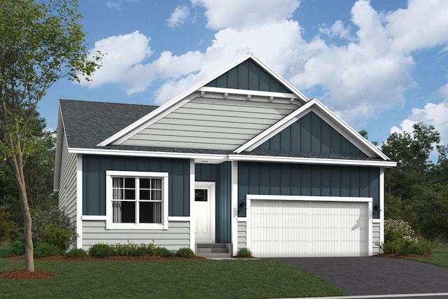 view of front facade with aphalt driveway, board and batten siding, a front yard, a shingled roof, and a garage