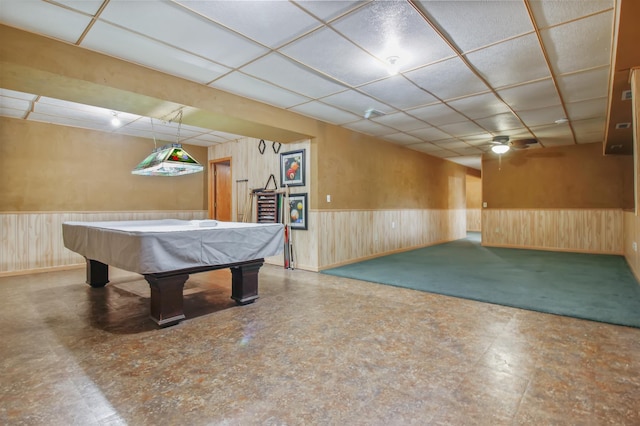 game room featuring a paneled ceiling, wooden walls, and billiards