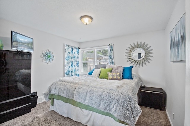 carpeted bedroom with baseboards