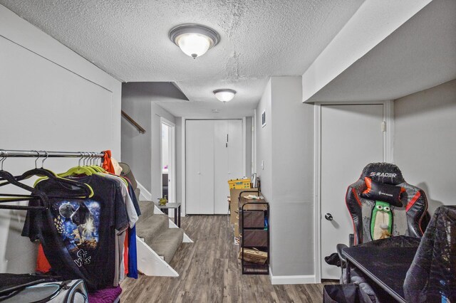 4812-4814 Idaho Ave N, Crystal, MN 55428 - foyer with wood finished floors, stairs, a textured ceiling, and baseboards