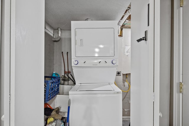 4812-4814 Idaho Ave N, Crystal, MN 55428 - washroom with stacked washer and clothes dryer and a textured ceiling