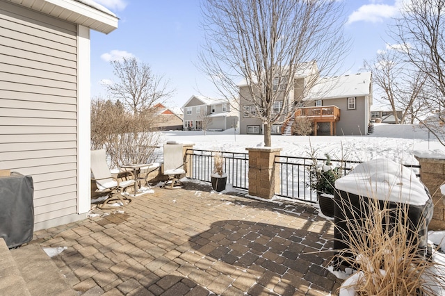 view of snow covered patio