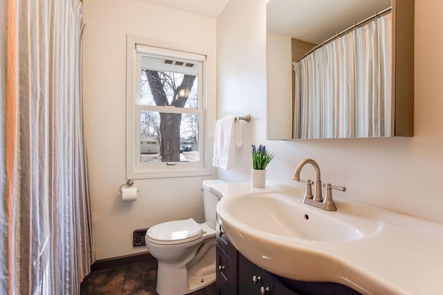 full bathroom featuring toilet and vanity