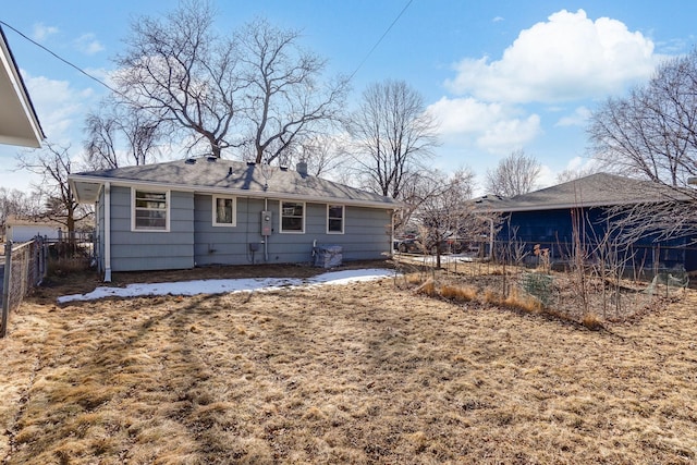 rear view of property with fence