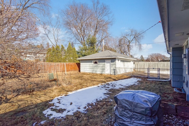 view of yard featuring an outdoor structure and a fenced backyard