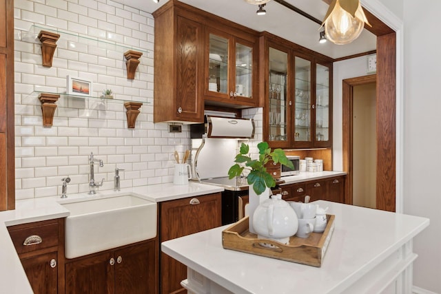 kitchen featuring sink and backsplash