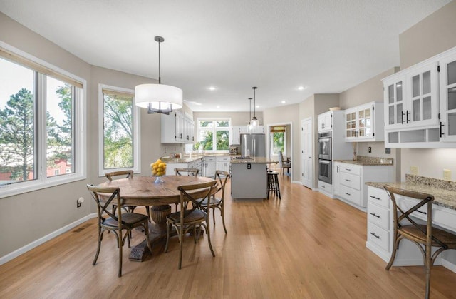 dining area with light wood-type flooring