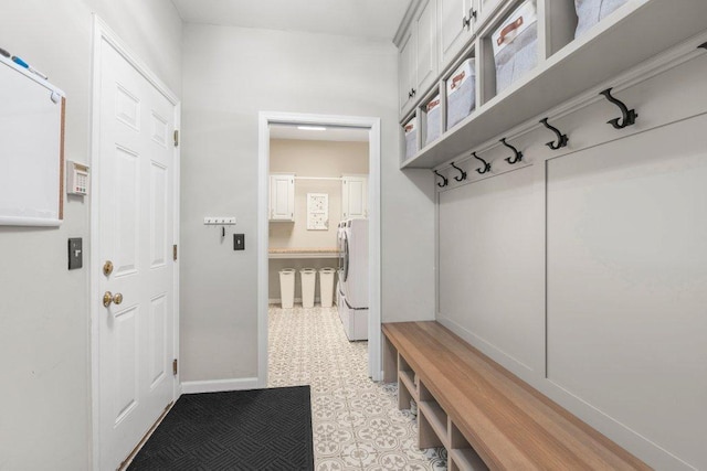 mudroom with washer and clothes dryer