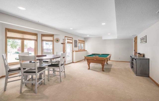 playroom featuring pool table, light colored carpet, and a textured ceiling