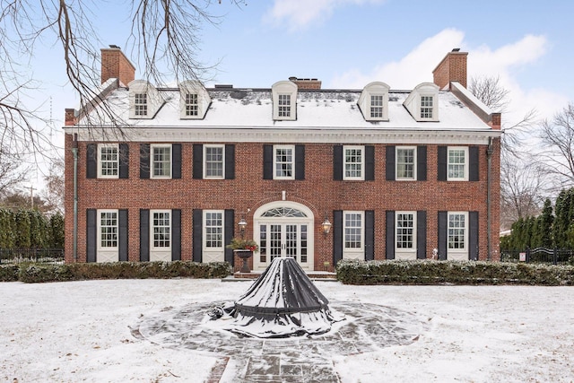 colonial inspired home featuring french doors