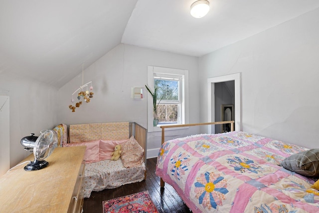 bedroom with lofted ceiling and hardwood / wood-style flooring