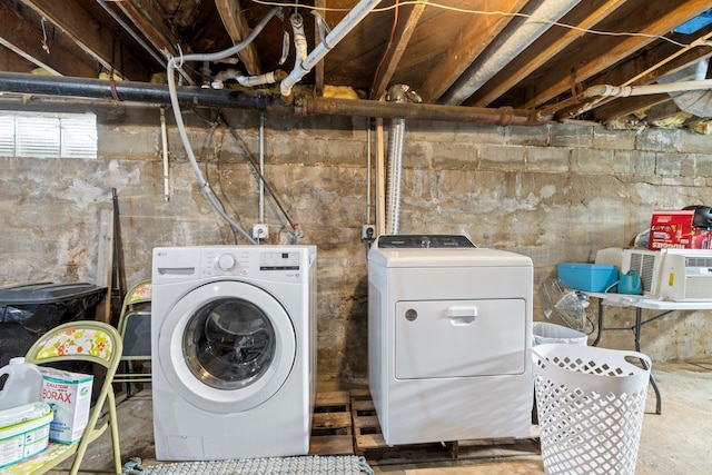 laundry area featuring laundry area and washing machine and dryer