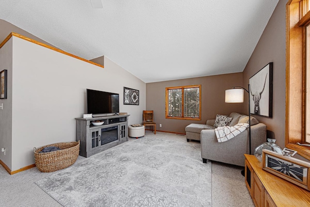 carpeted living room with vaulted ceiling