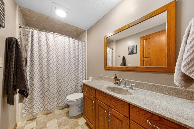 bathroom with vanity, toilet, a textured ceiling, and a shower with shower curtain