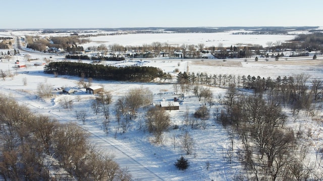 snowy aerial view featuring a rural view