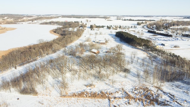 snowy aerial view featuring a rural view