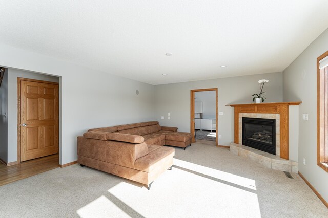 5078 Nicklaus Dr NW, Rochester, MN 55901 - carpeted living area with a fireplace and recessed lighting