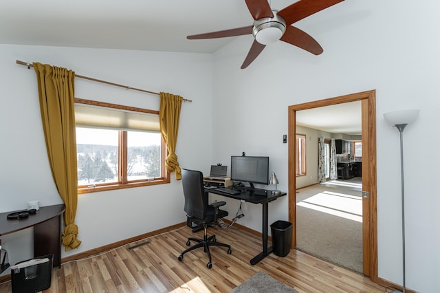 5078 Nicklaus Dr NW, Rochester, MN 55901 - office area featuring light wood finished floors, a ceiling fan, and high vaulted ceiling