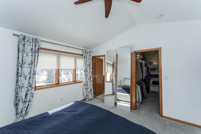 5078 Nicklaus Dr NW, Rochester, MN 55901 - carpeted bedroom featuring vaulted ceiling, a spacious closet, ceiling fan, and a closet