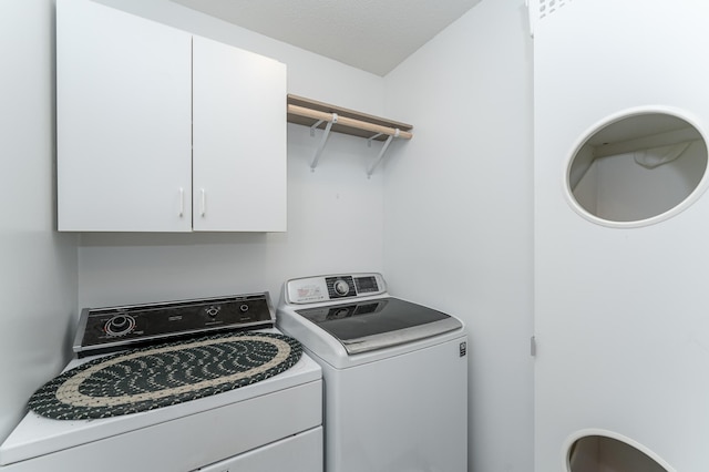 5078 Nicklaus Dr NW, Rochester, MN 55901 - washroom featuring washing machine and clothes dryer and cabinet space