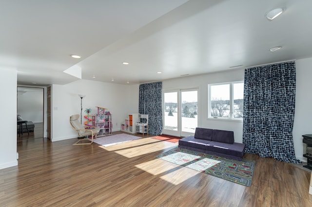 5078 Nicklaus Dr NW, Rochester, MN 55901 - living area featuring wood finished floors and recessed lighting