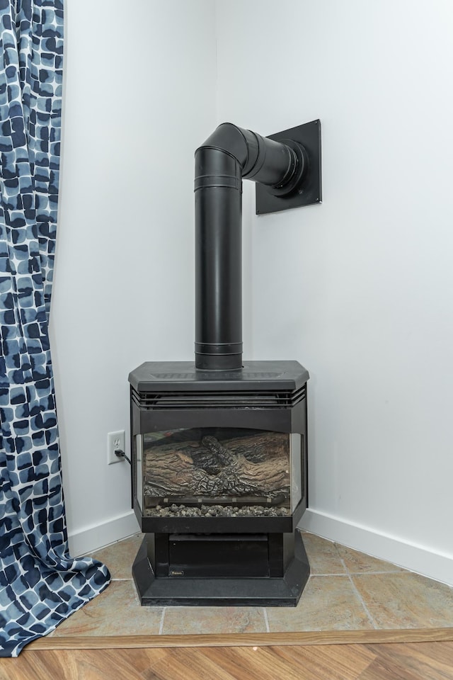 5078 Nicklaus Dr NW, Rochester, MN 55901 - detailed view of a wood stove and baseboards
