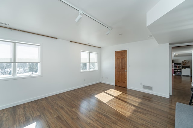5078 Nicklaus Dr NW, Rochester, MN 55901 - empty room with rail lighting and wood finished floors