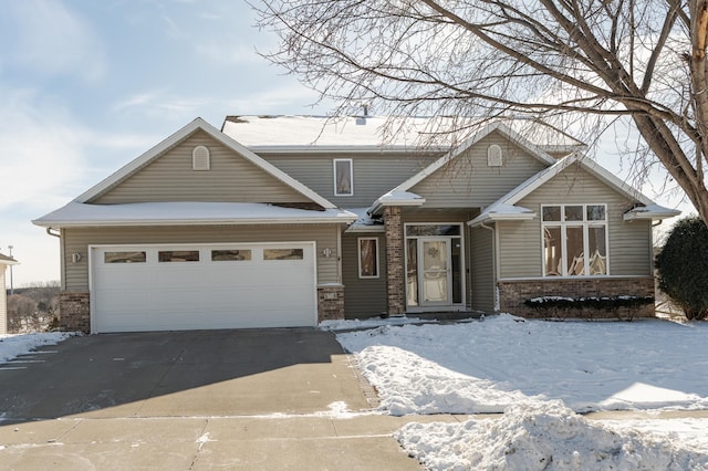 5078 Nicklaus Dr NW, Rochester, MN 55901 - view of front of property with brick siding, concrete driveway, and an attached garage