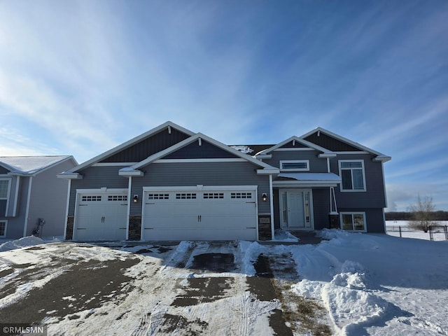 view of front facade featuring a garage and stone siding