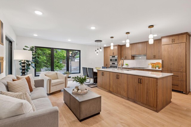 651 Sue Pl, Saint Paul, MN 55116 - living area featuring light wood-style flooring and recessed lighting